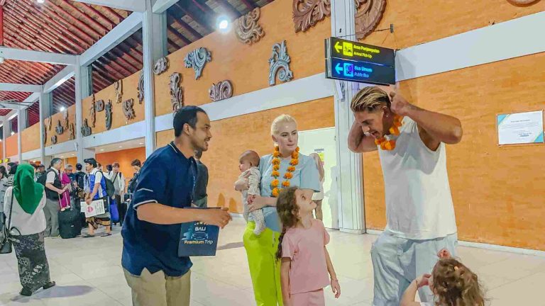 Family welcomed with flower garlands on arrival at Bali airport