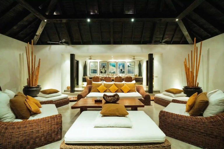 Open-plan family lounge with rattan sofas in a Bali villa