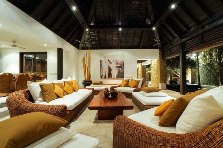 Spacious living room with rattan furniture in a Bali villa
