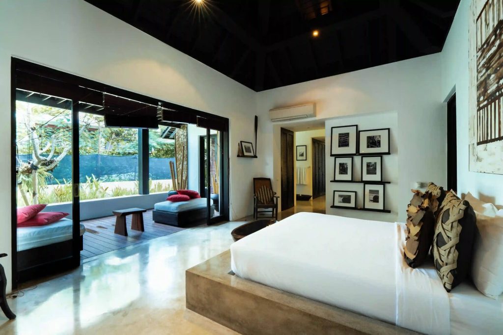 Compact master bedroom with garden views in a Bali villa