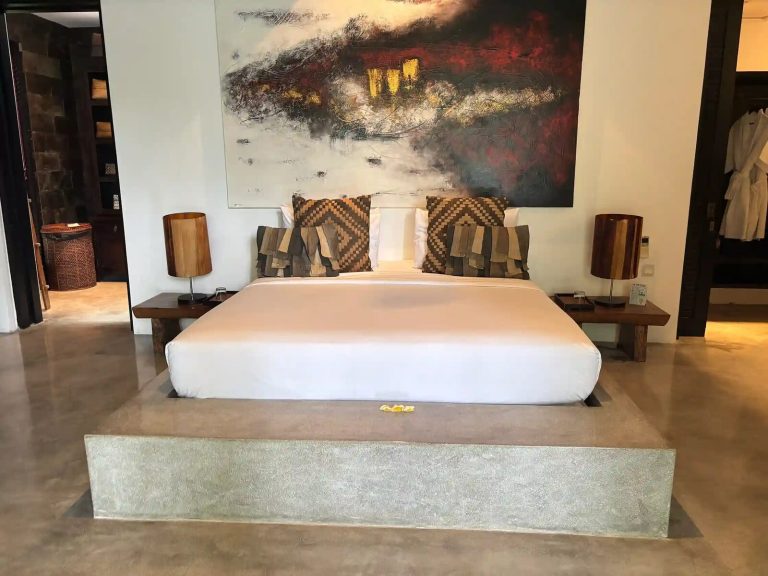 Freshly made bed in the master bedroom of a Bali villa