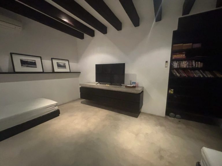 Media room with polished concrete floors in a Bali villa
