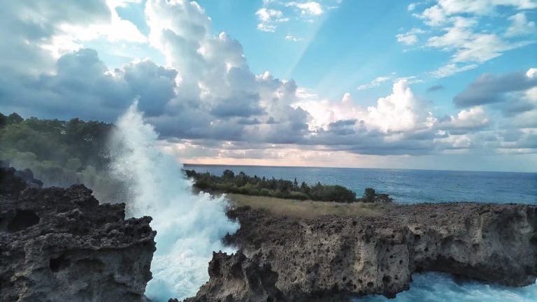Waves crashing against volcanic rock at Water Blow, Nusa Dua