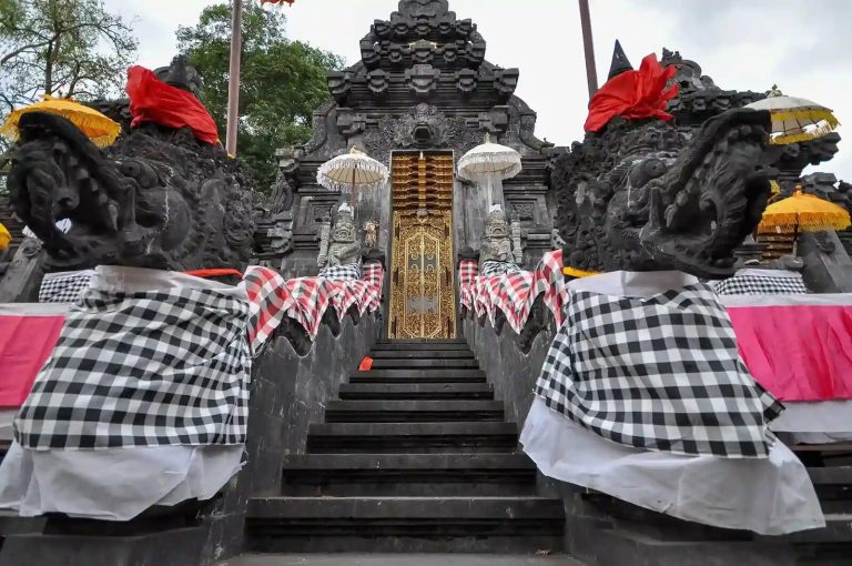 Temple steps dressed in poleng cloth at Pura Goa Lawah, Bali