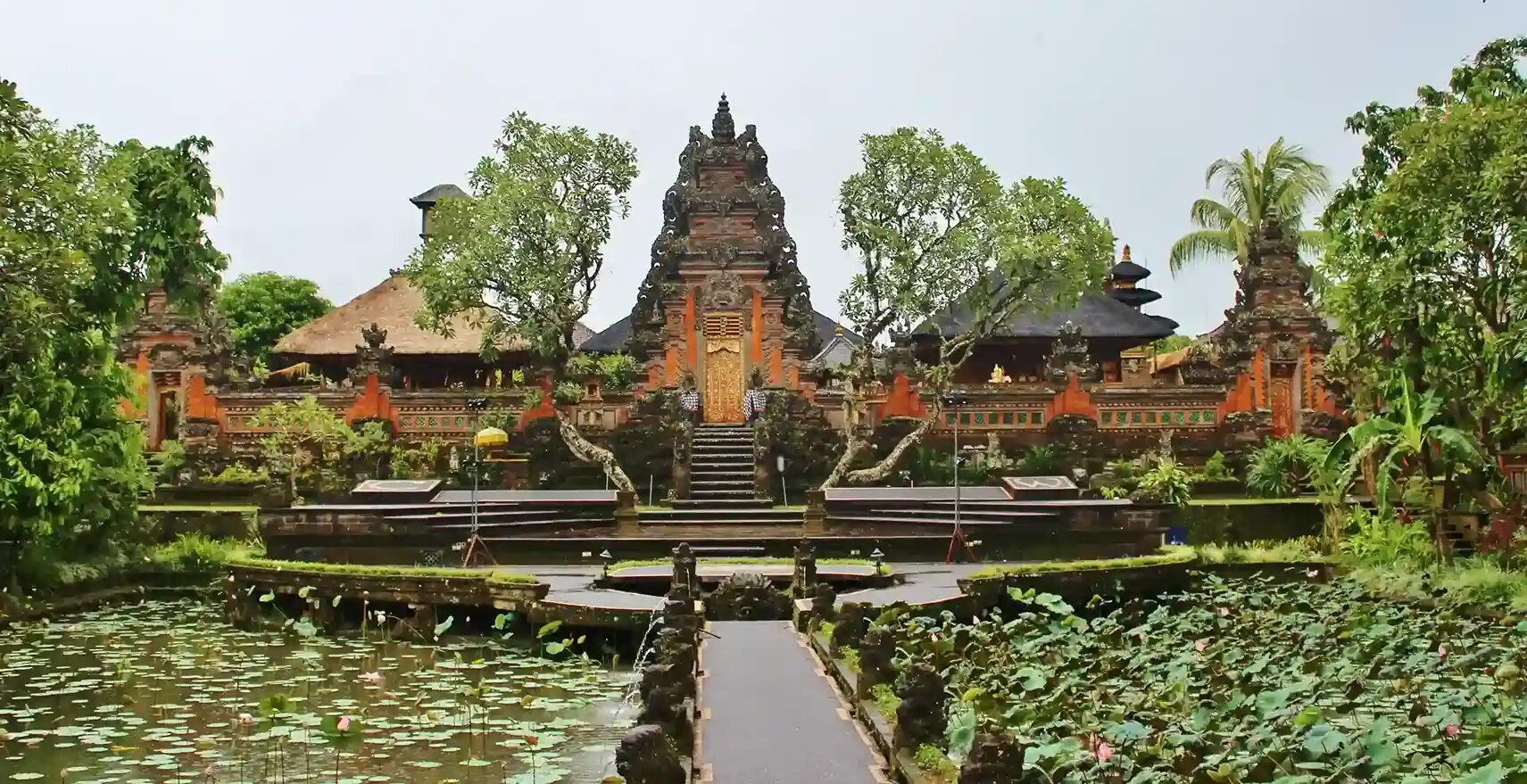 Lotus pond and temple gate at Pura Taman Saraswati in Ubud, Bali