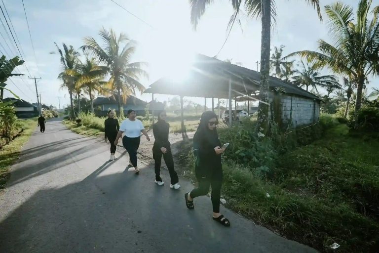 Morning walk along a palm-lined village road near Ubud